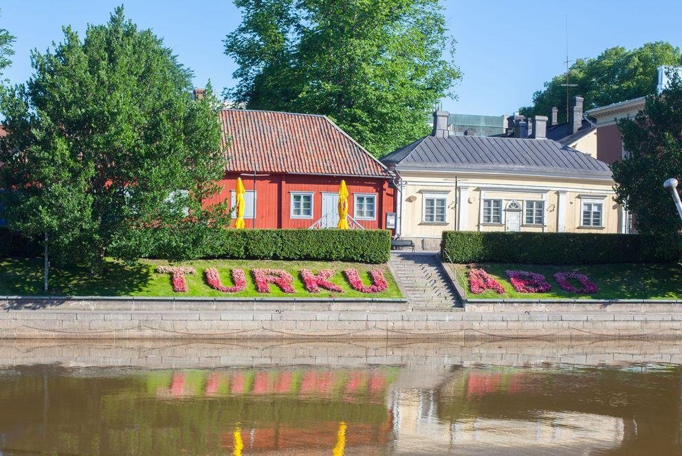 Beautiful wooden colorful houses near water in Finland